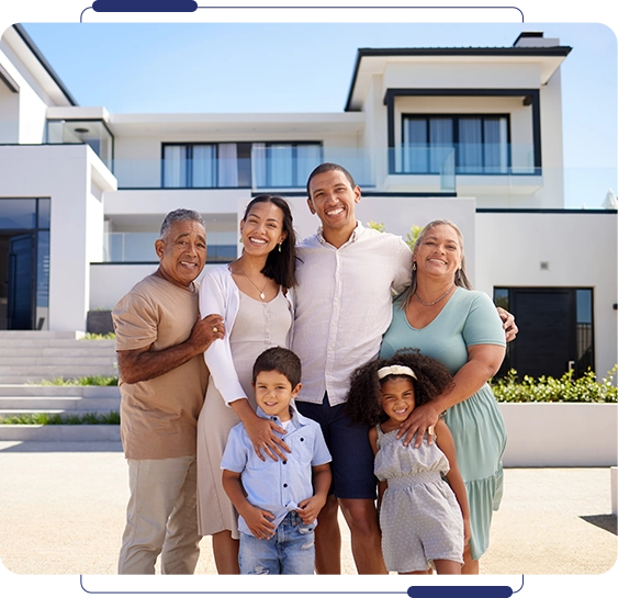 A family posing for a picture in front of their home.